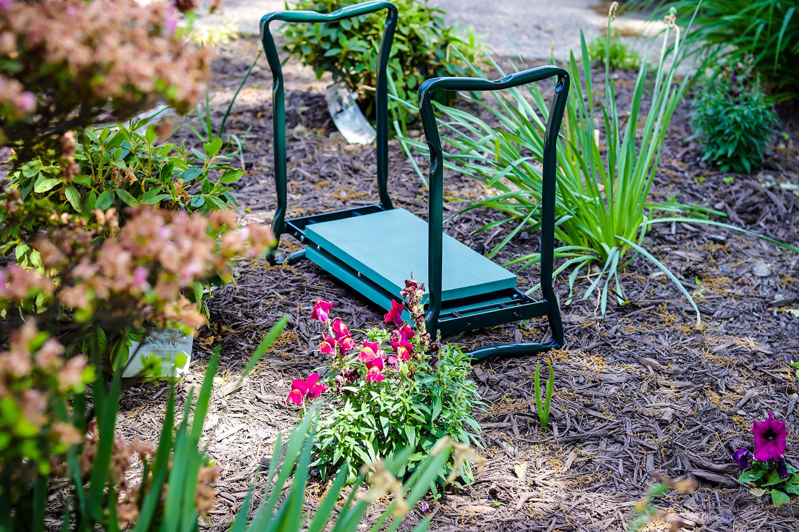 Trademark Innovations garden kneeler flipped to seat position for elevated gardening tasks.