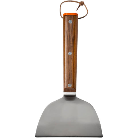 Traeger scraper cleans the flat top grill between rounds.