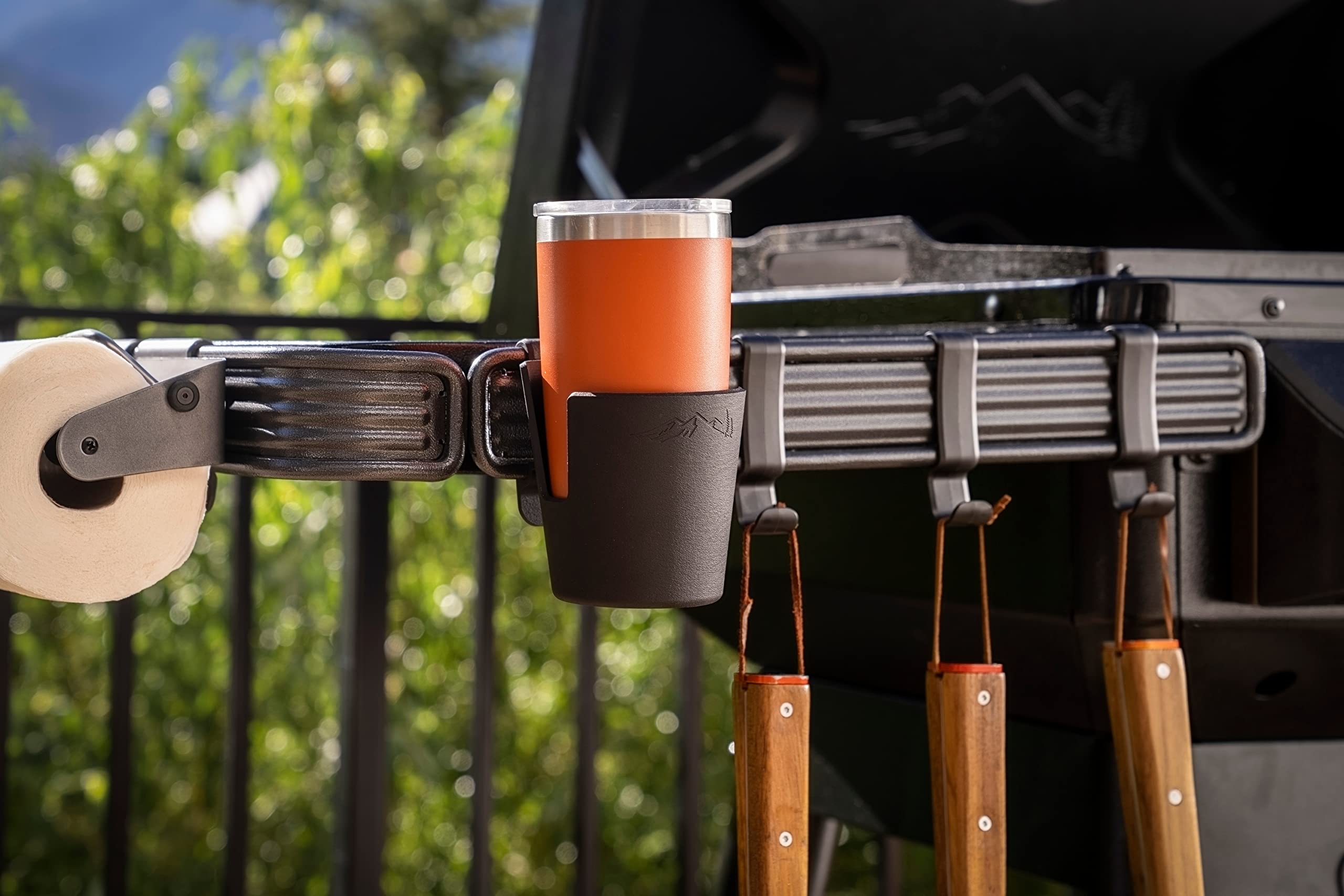 Traeger PAL cup holder mounted on grill demonstrating convenient beverage placement