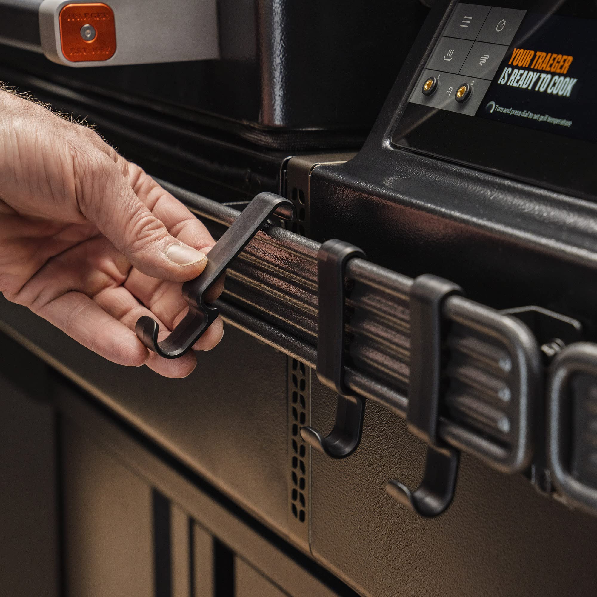 Traeger BAC643 P.A.L. hook snapped onto rail for easy organization.
