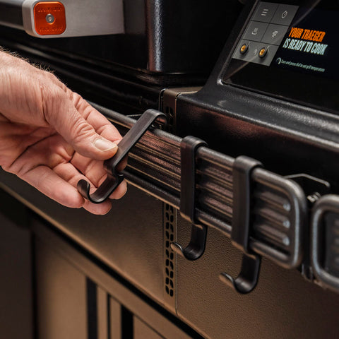 Traeger BAC643 P.A.L. hook snapped onto rail for easy organization.