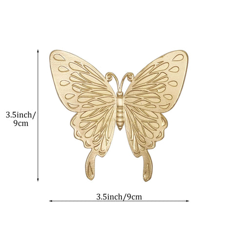 Tricune gold butterfly sculpture, top-down view, creates a refined shelf accent.