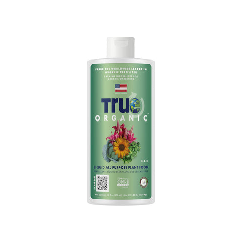True Organic Liquid All-Purpose Plant Food bottle pour supports easy feeding.
