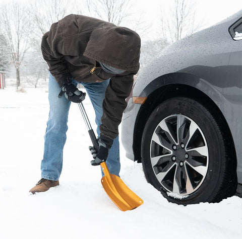 True Temper 3-in-1 shovel stored in car trunk for emergency readiness.