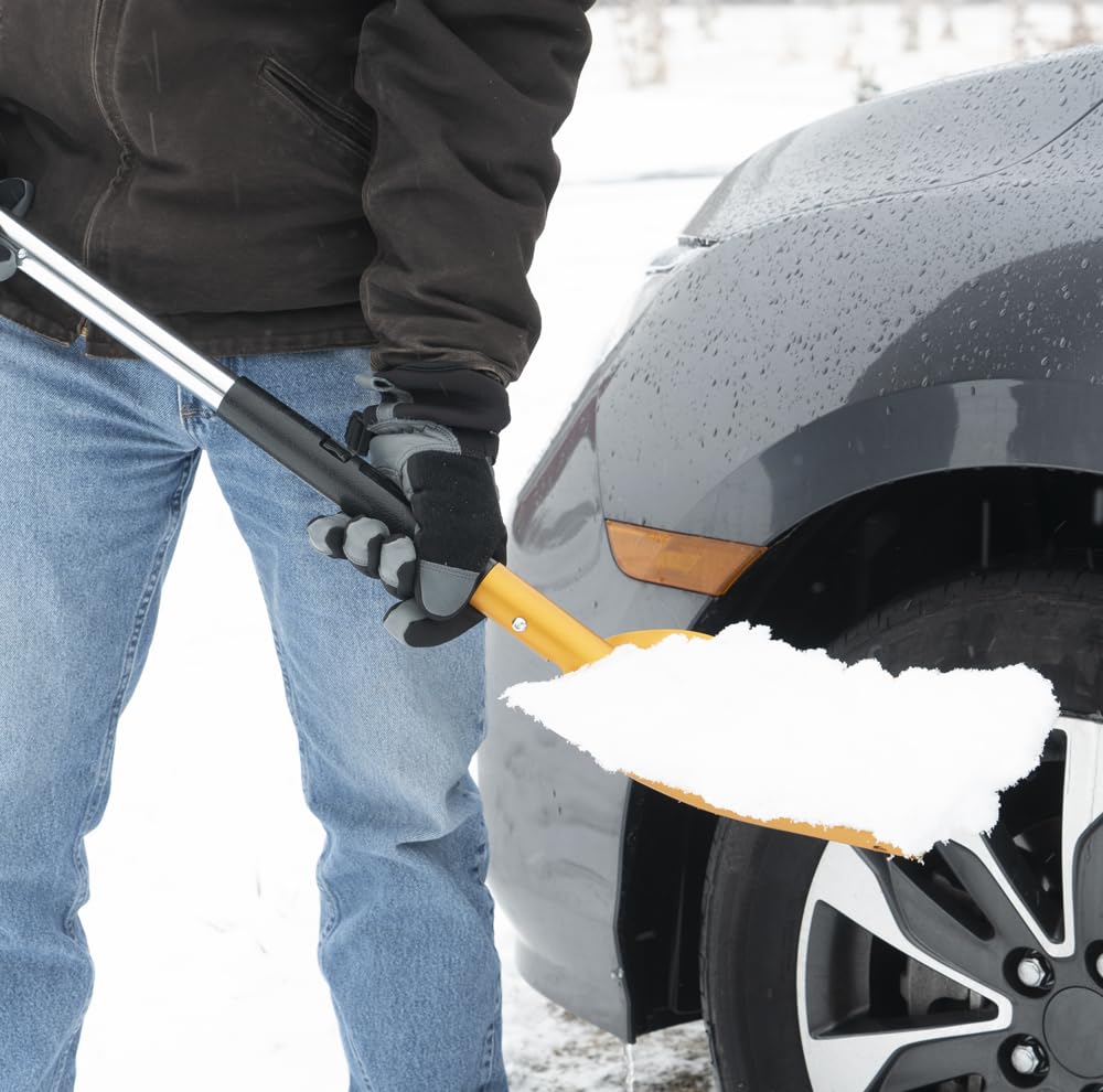 True Temper 3-in-1 snow brush with scraper attached for efficient surface cleanup.