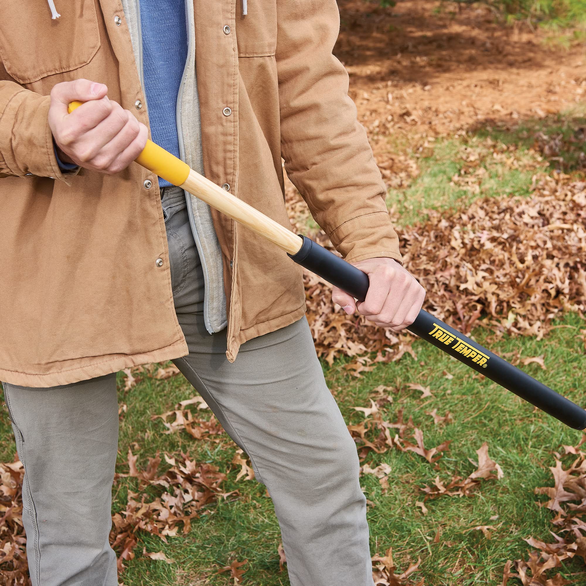 True Temper rake clearing leaves and debris efficiently.
