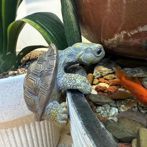 TSCVPJL Outdoor-friendly tortoise sculpture brightens pots, fences, and fairy gardens
