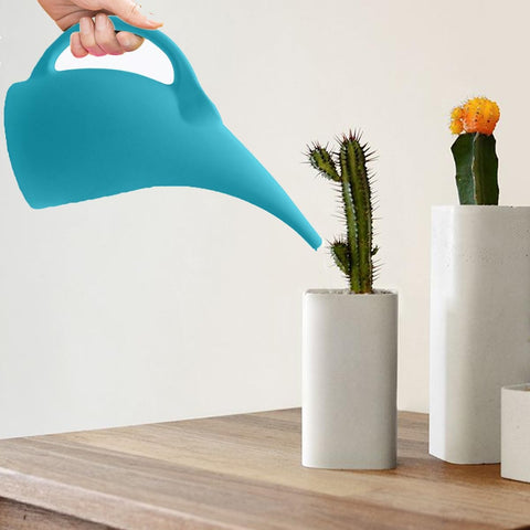 TTAOE GN blue watering can in use, watering potted plants with accuracy.