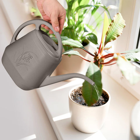 TTAOE GN durable plastic watering can designed for regular gardening tasks.
