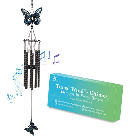 Tuned Wind butterfly wind chime outdoors in black blue, adds calming ambiance to your garden.