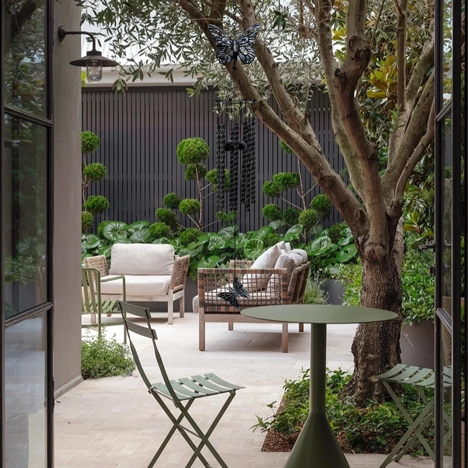 Tuned Wind butterfly wind chime hanging on a porch for elegant exterior decor