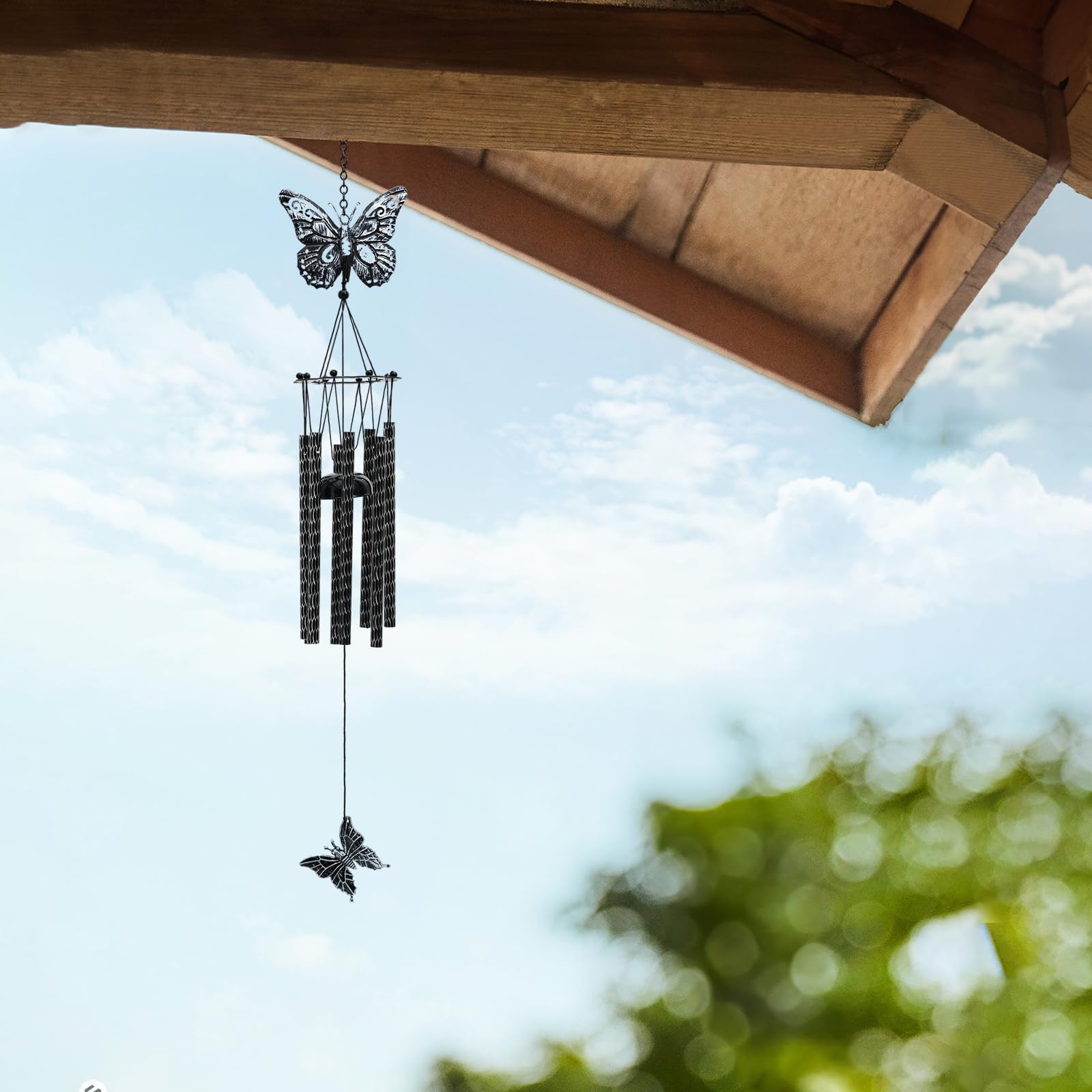 Tuned Wind garden wind chime enhancing a lush outdoor space