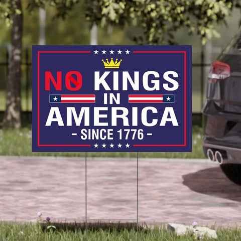 TUOCYERD 18x12 inch yard sign in a home yard, clear anti-hate message.
