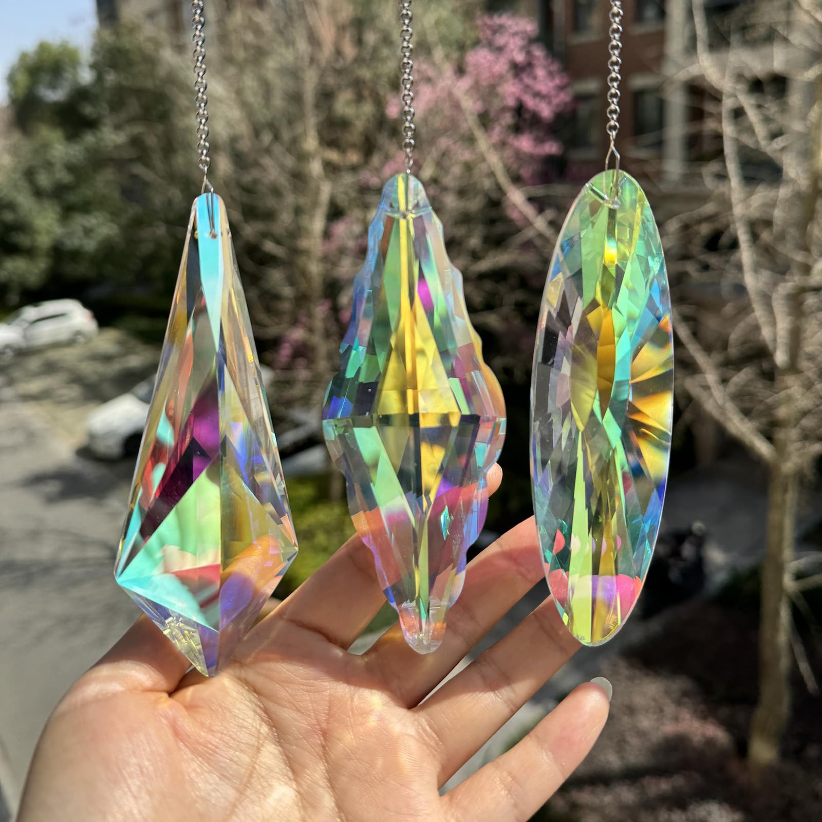 TXXNSM 3-piece crystal sun catchers in window casting vibrant rainbows.