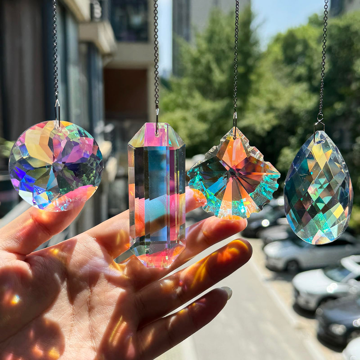 TXXNSM crystal sun catcher prism on a window casts vivid rainbows.