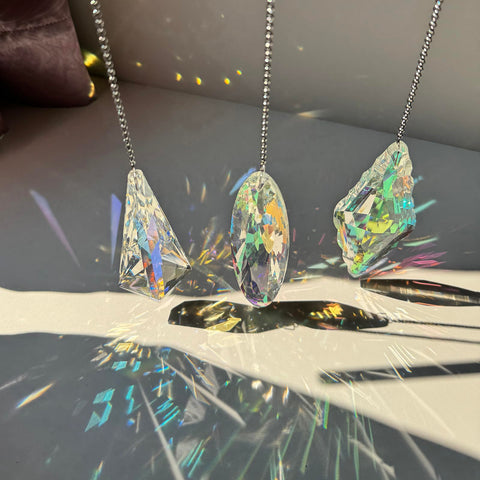 TXXNSM crystal sun catcher prisms close-up showing glass facets sparkle.
