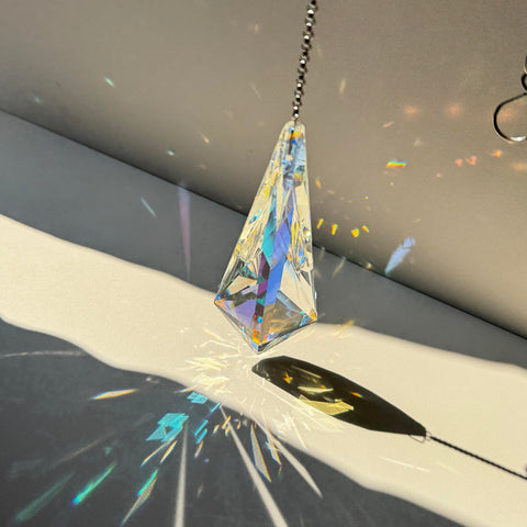 TXXNSM window display projects rainbow colors across walls and surfaces.