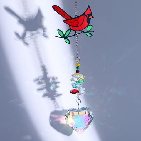 Tyqour crystal cardinal suncatcher window display catching sunlight and color