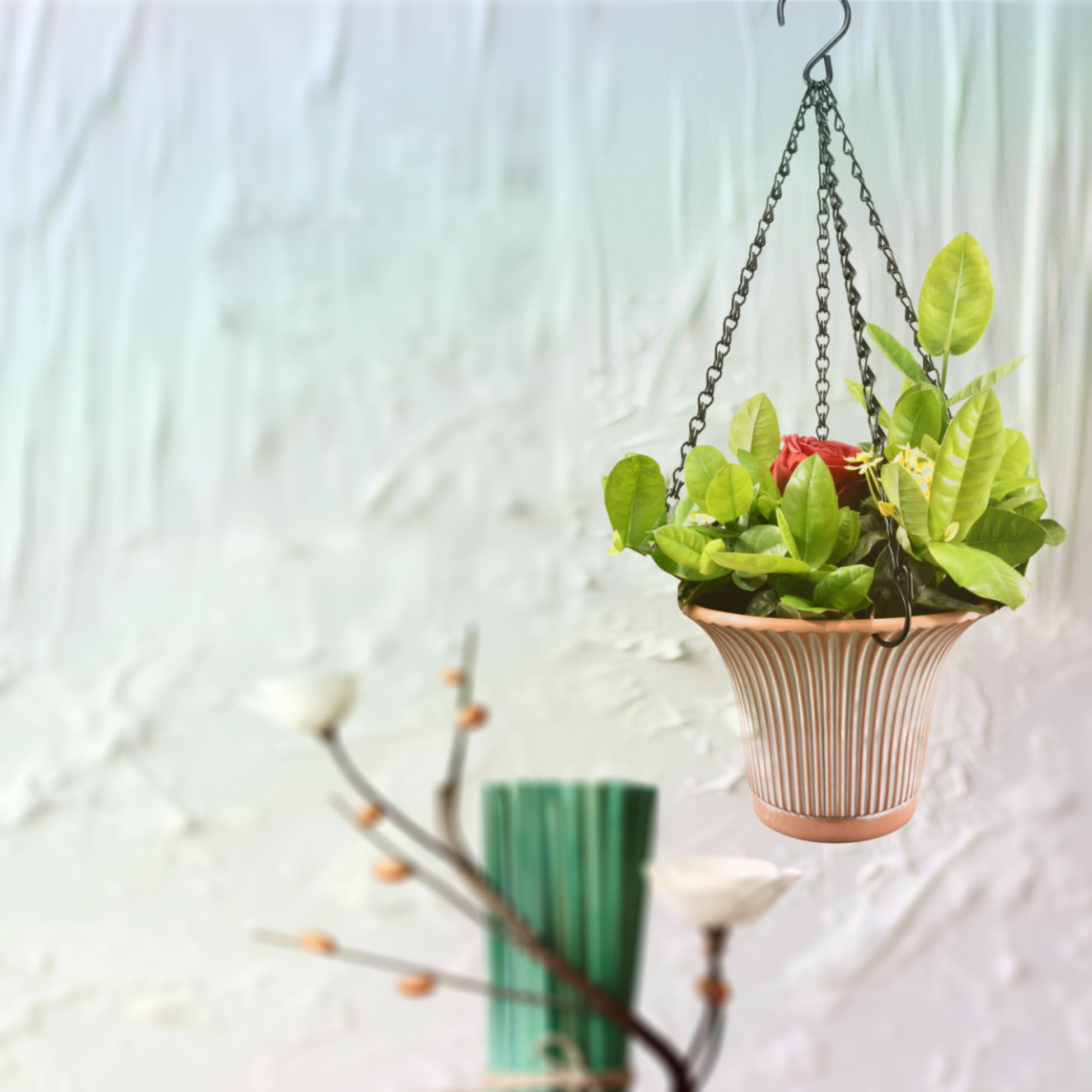 Chain suspending a lantern and bird feeder for garden display