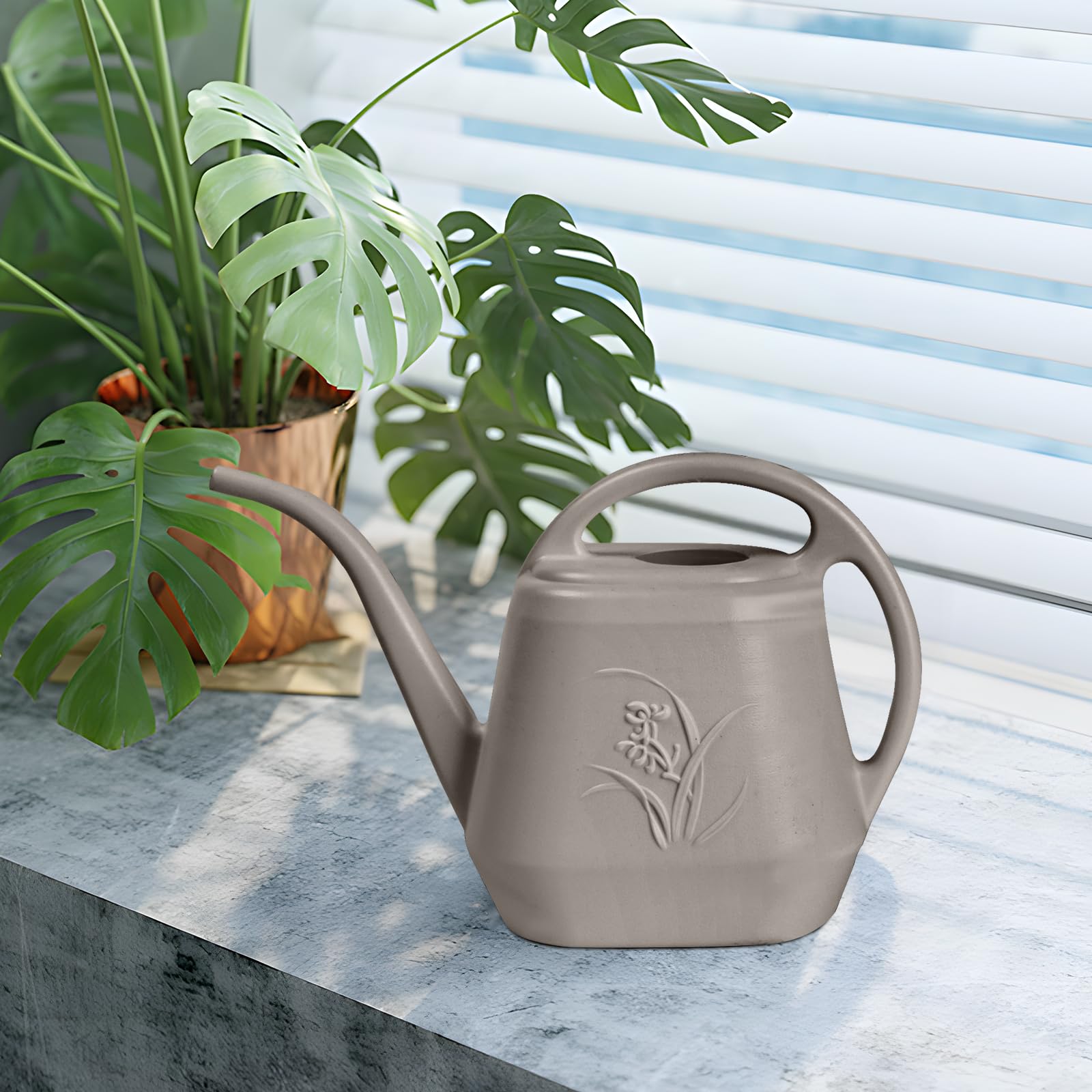 UFANME watering can in use among plants, illustrating practical garden tool for gentle watering.
