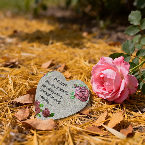 UGKIamous heart stone displayed on a grave or memorial plaque outdoors