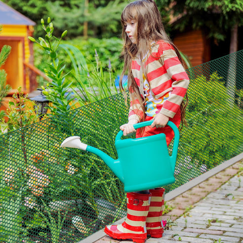 UJG plant guard in use shows easy stake anchoring for garden beds.