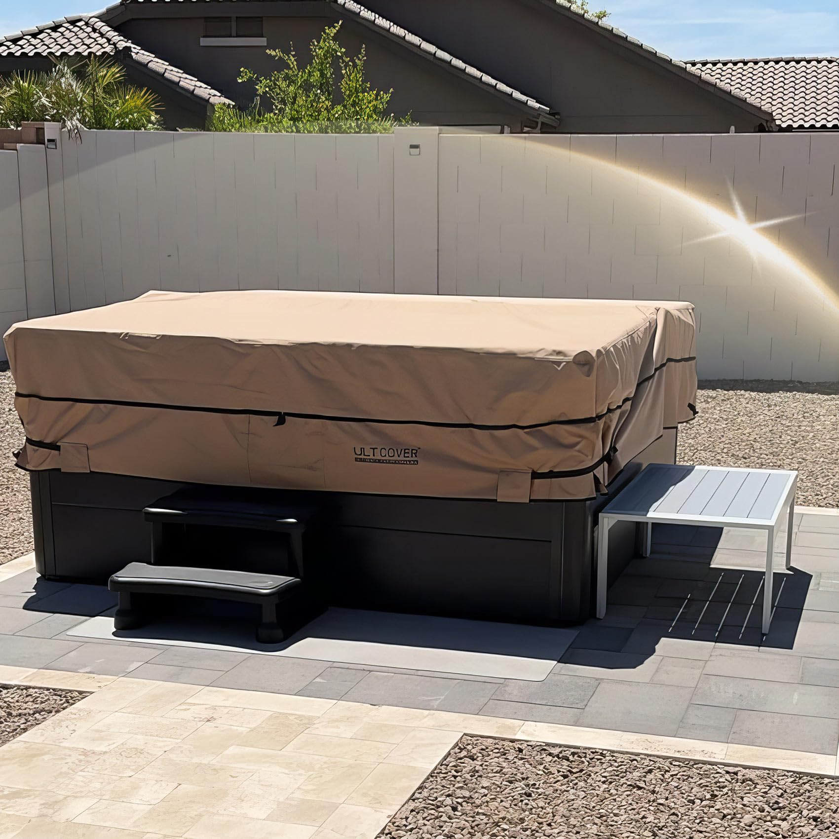 ULTCOVER weather protection cover shields the hot tub from rain, snow, and debris.