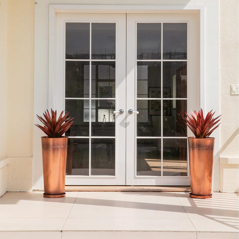 UltiTeque copper planter saucers with holes for mess-free watering.