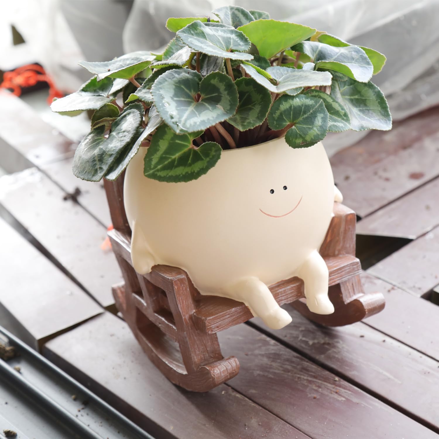 UMESONG Smily Face Planter rocking chair brightens indoor or outdoor spaces.