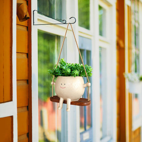 UMESONG swing planter enhances string of pearls display indoors.