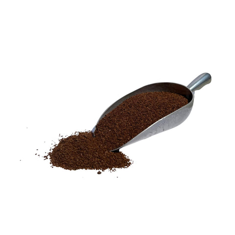 Application of Unearthed Dried Molasses as a soil conditioner in garden beds.