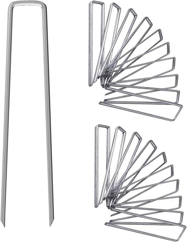 UPMCT 12-inch galvanized staples securing landscape fabric with rust resistance.