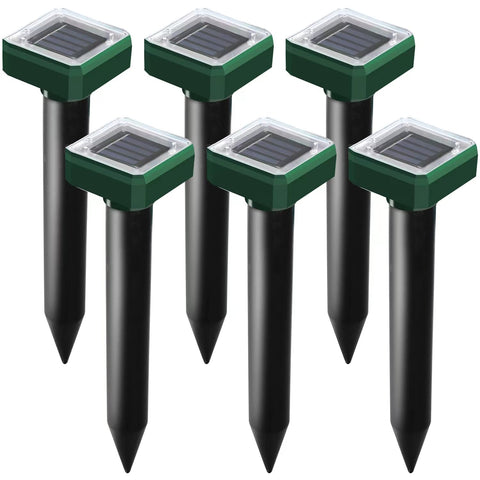 USKICH solar mole-repellent spike installed in garden deters burrowing pests.