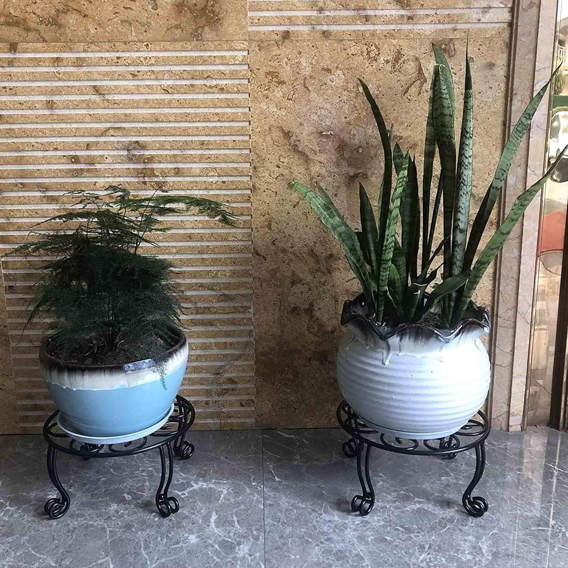 Four double-solid iron legs provide a stable outdoor plant display.