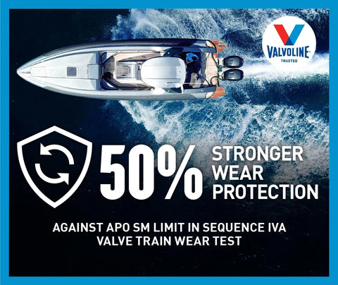 Valvoline marine oil bottle beside boat motor ready for sea lubrication.