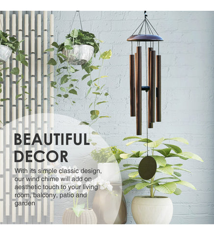 Vanquer wind chimes in an outdoor garden setting as decorative focal point.