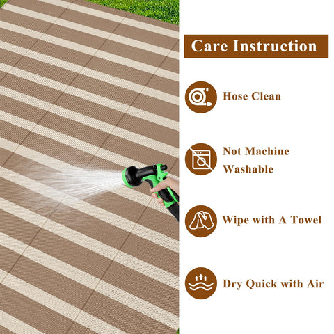 Vaukki outdoor rug with corner loops and stakes for wind resistance.