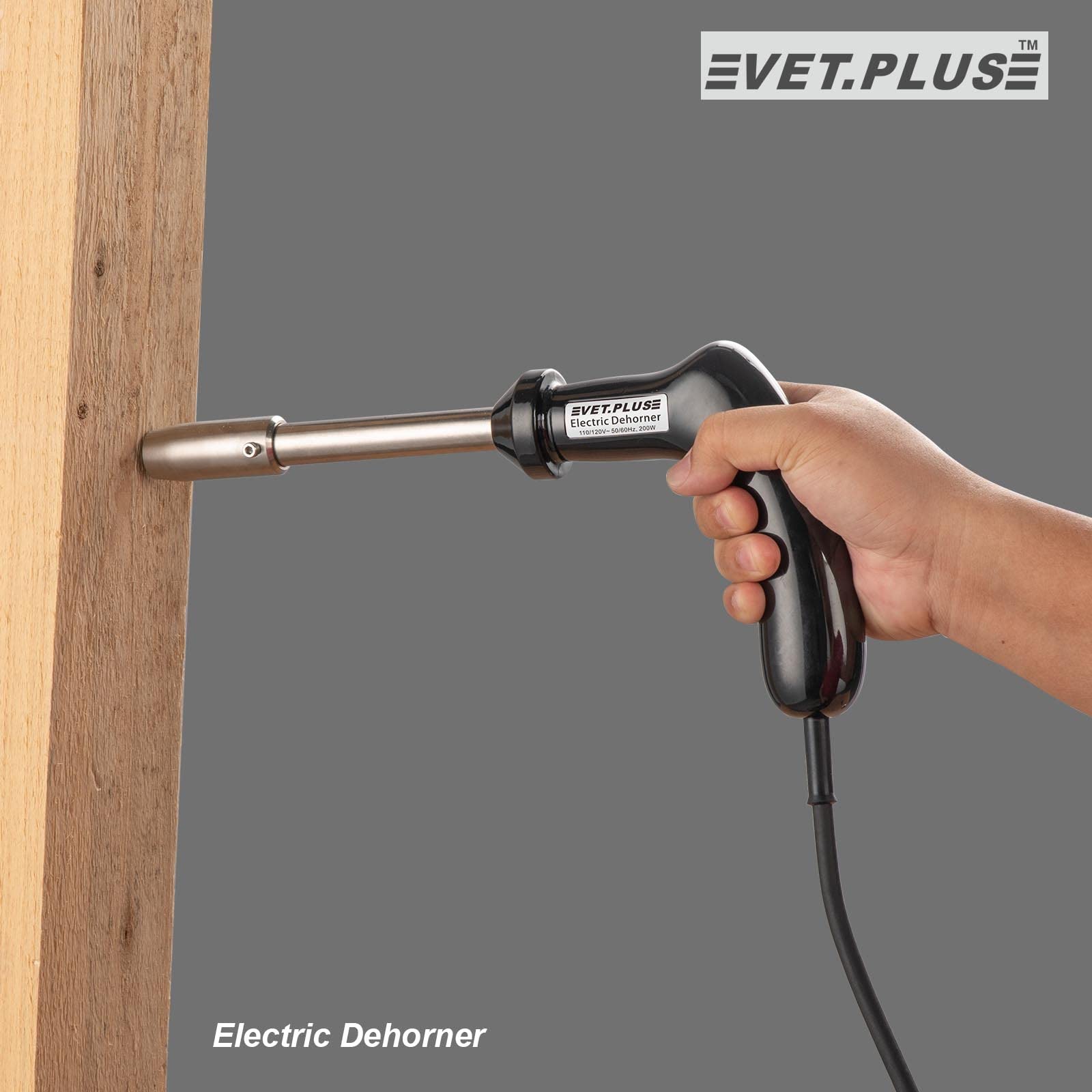 VET.PLUS electric dehorner in operation on calf demonstrates efficiency.