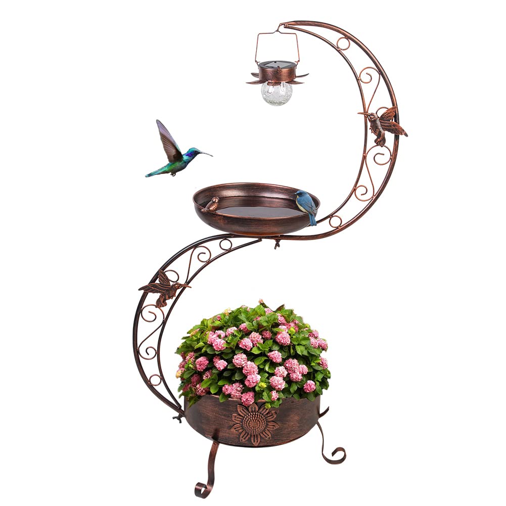 VEWOGARDEN bird bath outdoors with solar lamp glowing softly at dusk