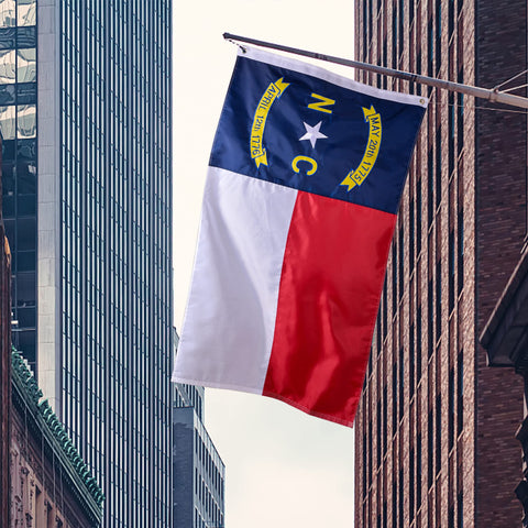 VICDRIA NC flag shown hanging on wall or porch for impact