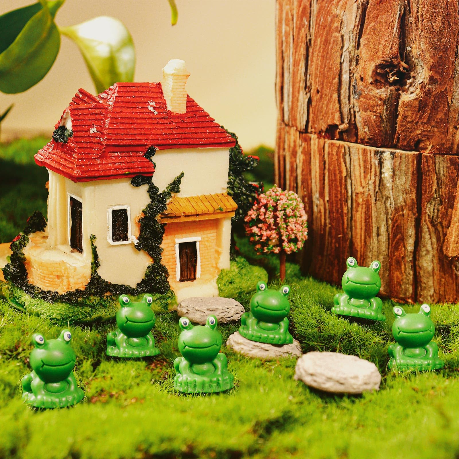 VICROIC dollhouse scene with mini frogs adds whimsy and color.