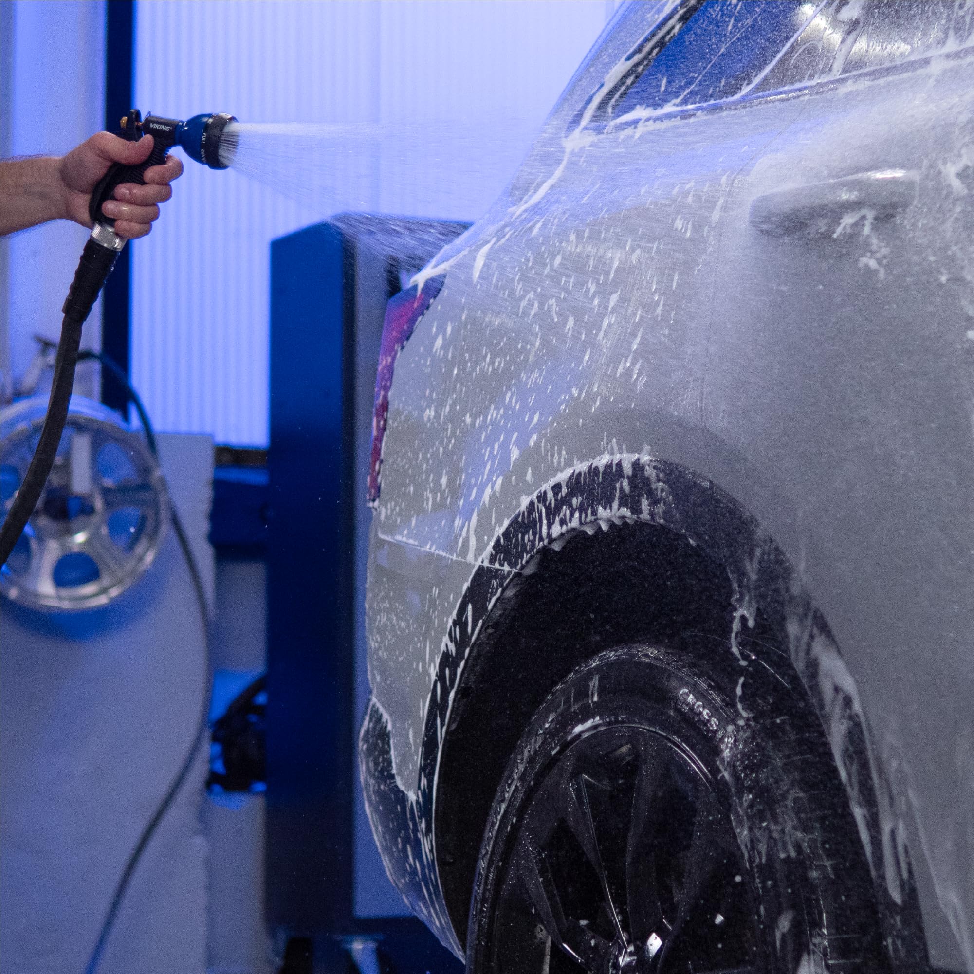 Powerful car-wash spray from VIKING nozzle for exterior cleaning.