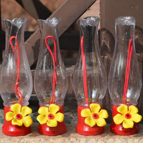 VIMOA patio balcony setup with red feeder attracting hummingbirds.