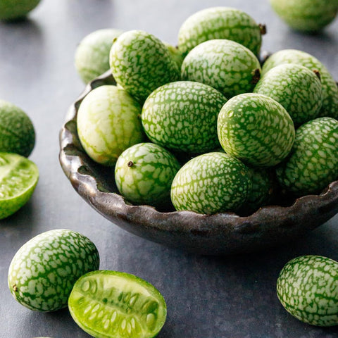 VISTATU mini watermelon fruit close-up; tiny, sweet fruit with refreshing flavor.