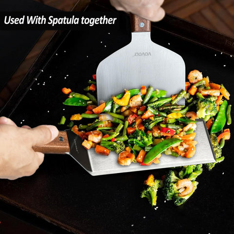 Vovoly cleaning tool in action demonstrates rugged, multi-use grilling support.