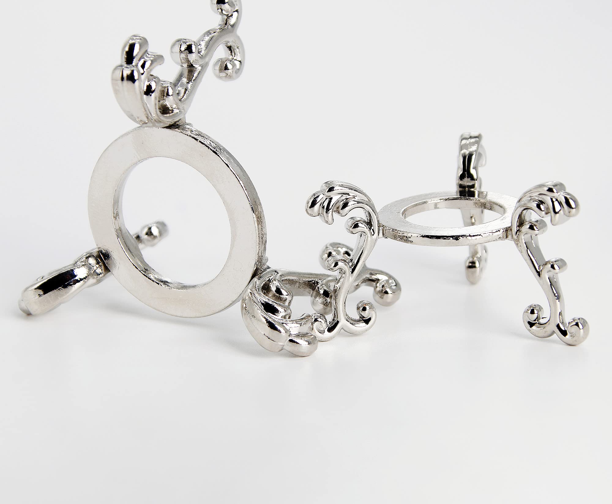 vskikris silver-plated crystal ball stand for small spheres on a desk.