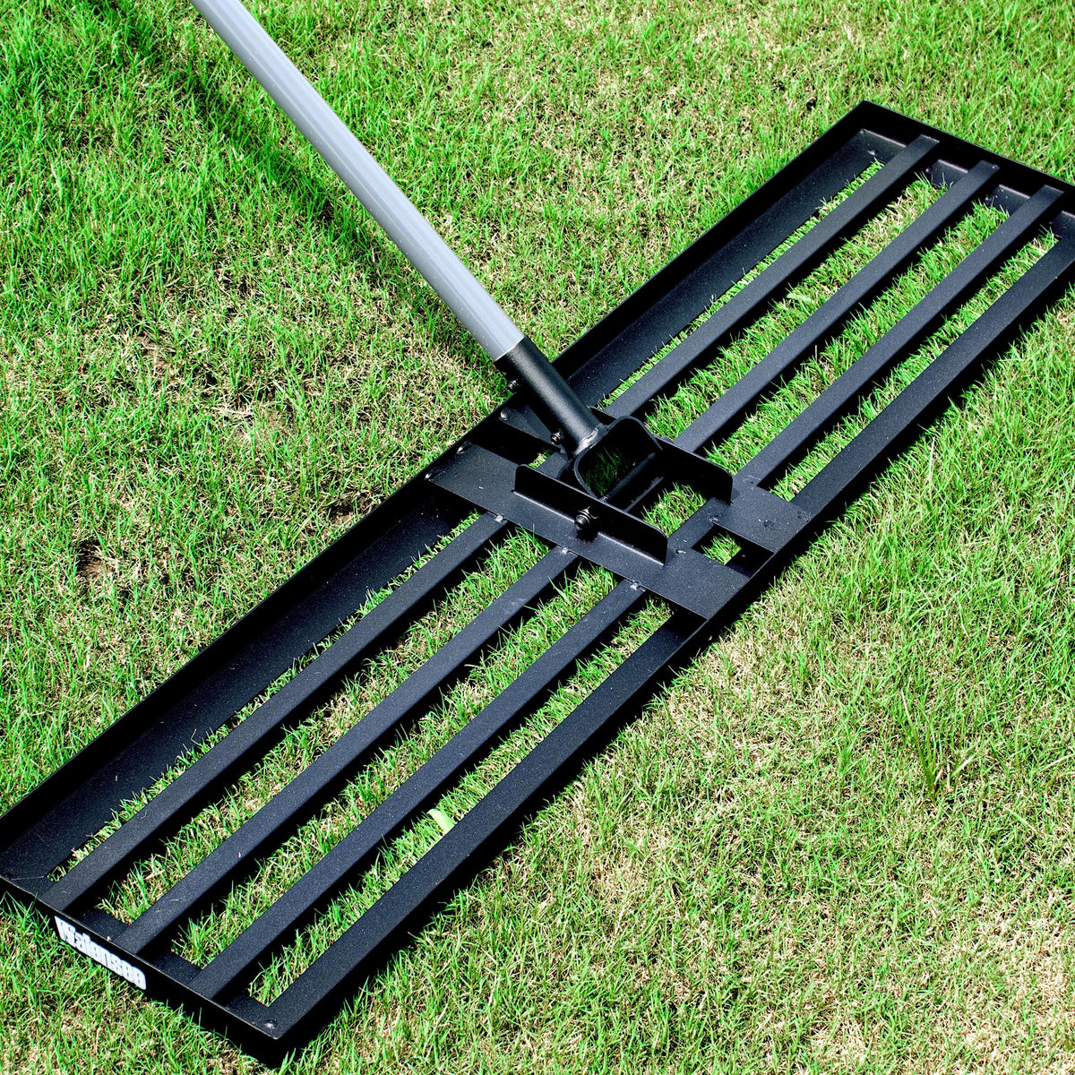 Walensee Lawn Leveling Rake side view shows durable steel construction for efficient yard leveling.