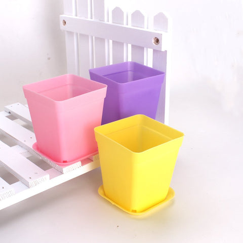 WARMBUY purple pots with saucers for colorful plant displays.