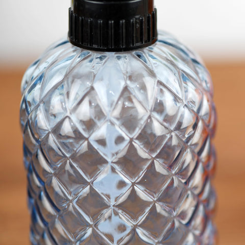 Wartter spray bottle demonstrated for kitchen cleaning and surface control.
