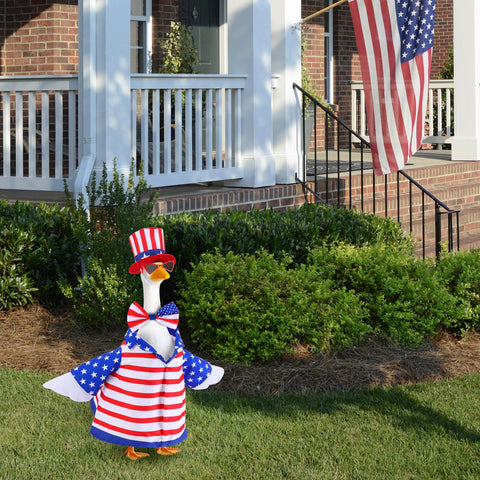 Watayo outdoor patio yard goose decor shown in a sunny garden.